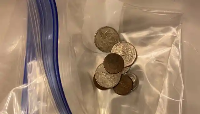 Place A Bag Weighed Down With Coins Over Your Drains